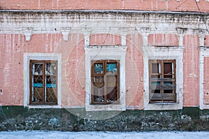 Old Windows with broken glass and broken frames in the old house.