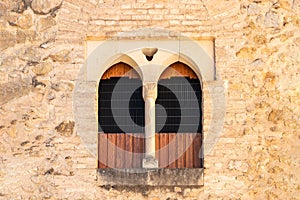 Old windows on brown stone wall for texture