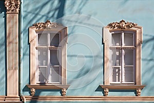 Old windows with carved architraves