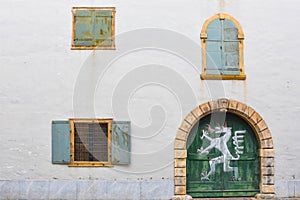 Old windows and door of the Styrian Armoury Landeszeughaus, in the city center of of Graz,