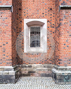 Old windows in red brick wall