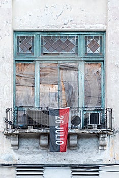 Old windows setting with red and black flag