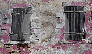 Old windows with weathered wood shutters