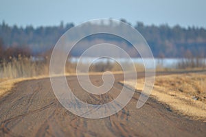 Old windy dirt / gravel road in the Crex Meadows Wildlife Area in Northern Wisconsin in late winter / early spring