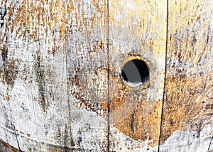Old wine barrel with hole