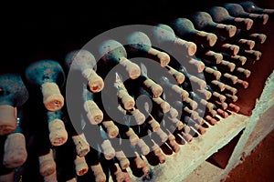 Old wine bottles in cellar. Old wine cellar in the Republic of M