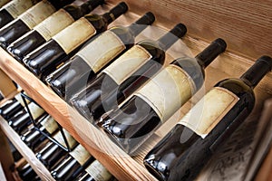 Old wine bottles on the wine shelf.