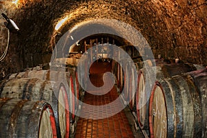 Old wine cellar with barrels of wine