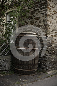 an old wine or whiskey barrel outside under a tree in Germany