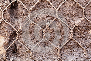 Old wire netting in concrete