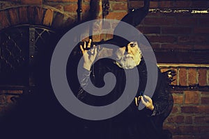 Old wizard with pendulum