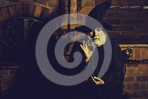 Old wizard with pendulum