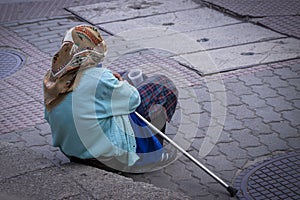 Old woman begging on the street
