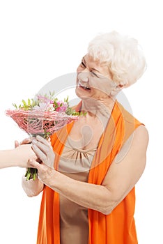 An old woman with bouquet of flowers.