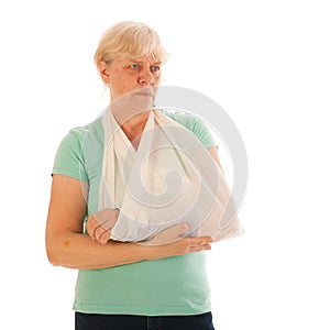 Old woman with broken wrist in gypsum