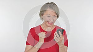 Old Woman Celebrating on Smartphone on White Background