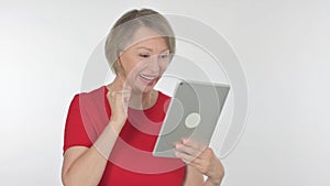 Old Woman Celebrating Success on Tablet on White Background