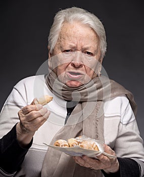 Old woman choking with cookie