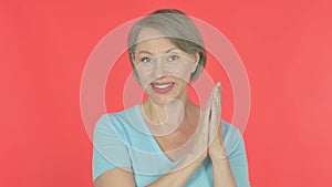Old Woman Clapping, Applauding on Red Background