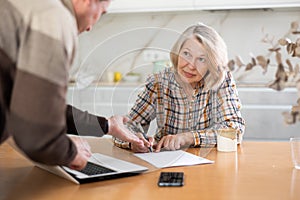 Old woman considering offer from agent photo