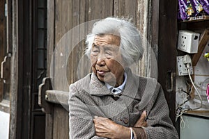 Old woman contemplates the past...