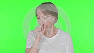 Old Woman Coughing on Green Background