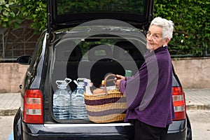 Old woman downloading the car