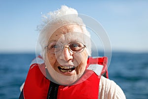 Old woman enjoys a boat ride