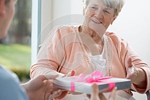 Old woman giving present