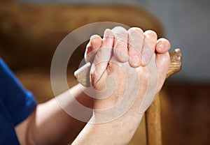 Old woman hands with cane