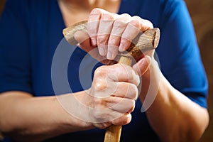 Old woman hands with cane