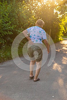 Old woman has back pain. Selective focus.