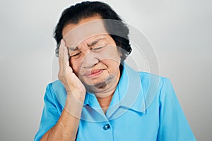 Old woman have a headache