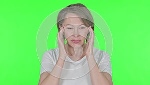 Old Woman with Headache on Green Background