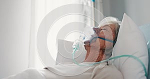 Old woman, healthcare and oxygen mask, sick with elderly care in hospital or nursing home with health problem. Female