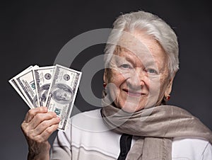 Old woman holding money in hands