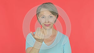 Old Woman Inviting on Red Background