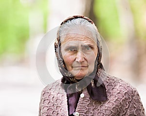 Old woman with kerchief outdoor