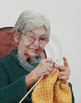 Old woman knitting photo