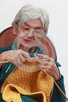 Old woman knitting photo