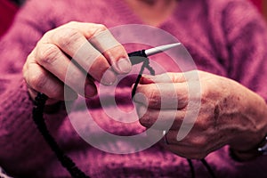 Old woman knitting