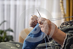 Old woman knitting hand