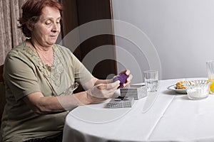 Old woman looking at gift box accepting present