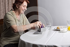 Old woman looking at gift box accepting present