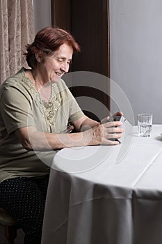 Old woman looking at gift box accepting present