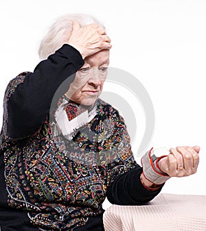 The old woman measures arterial pressure