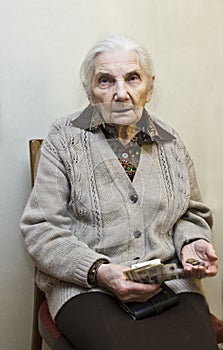 Old woman with money in hands