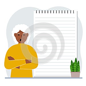A old woman next to a large notepad or large notebook. The concept of filling a notebook or notepad, writing notes, time