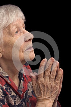 Old woman prays photo
