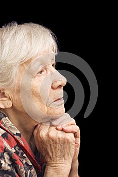 Old woman prays photo